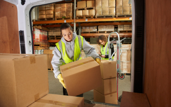 women loading a van with black friday parcels